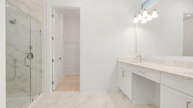 a bathroom with a double vanity sink and a mirror