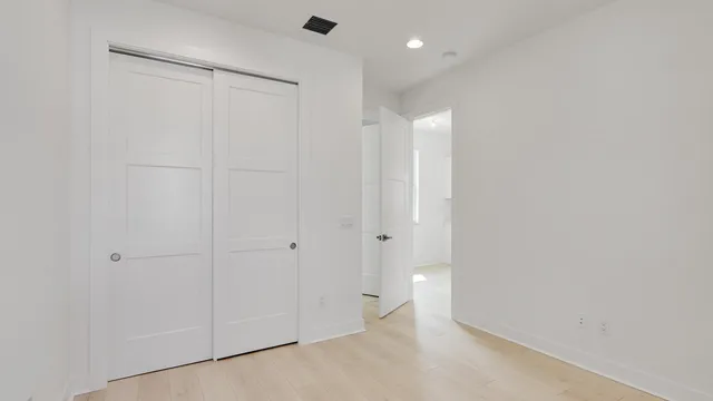 a view of cabinets a sink and dishwasher in a white cabinet