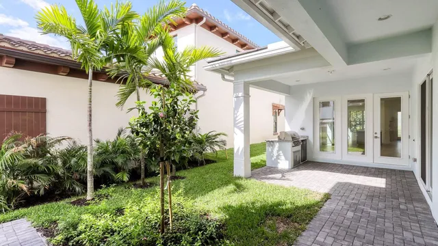 a flower plants in front of a house