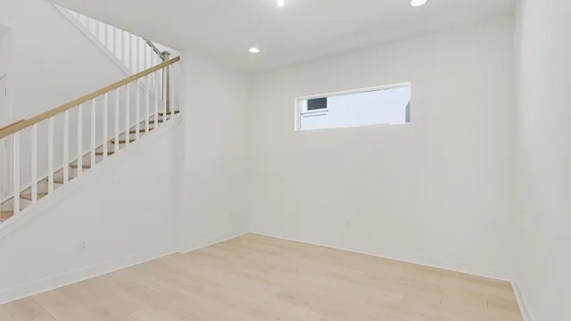 a view of an empty room with stairs