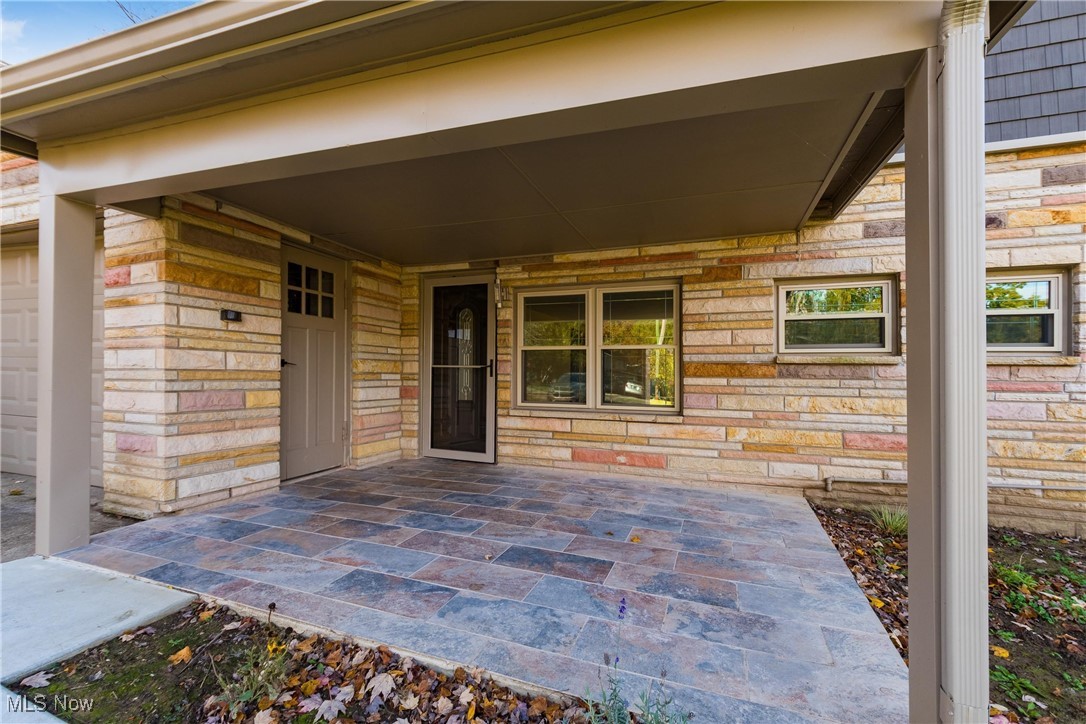 724 Garden Road Zanesville, OH 43701 - Photo 2 of 22 Doorway to property featuring stone siding