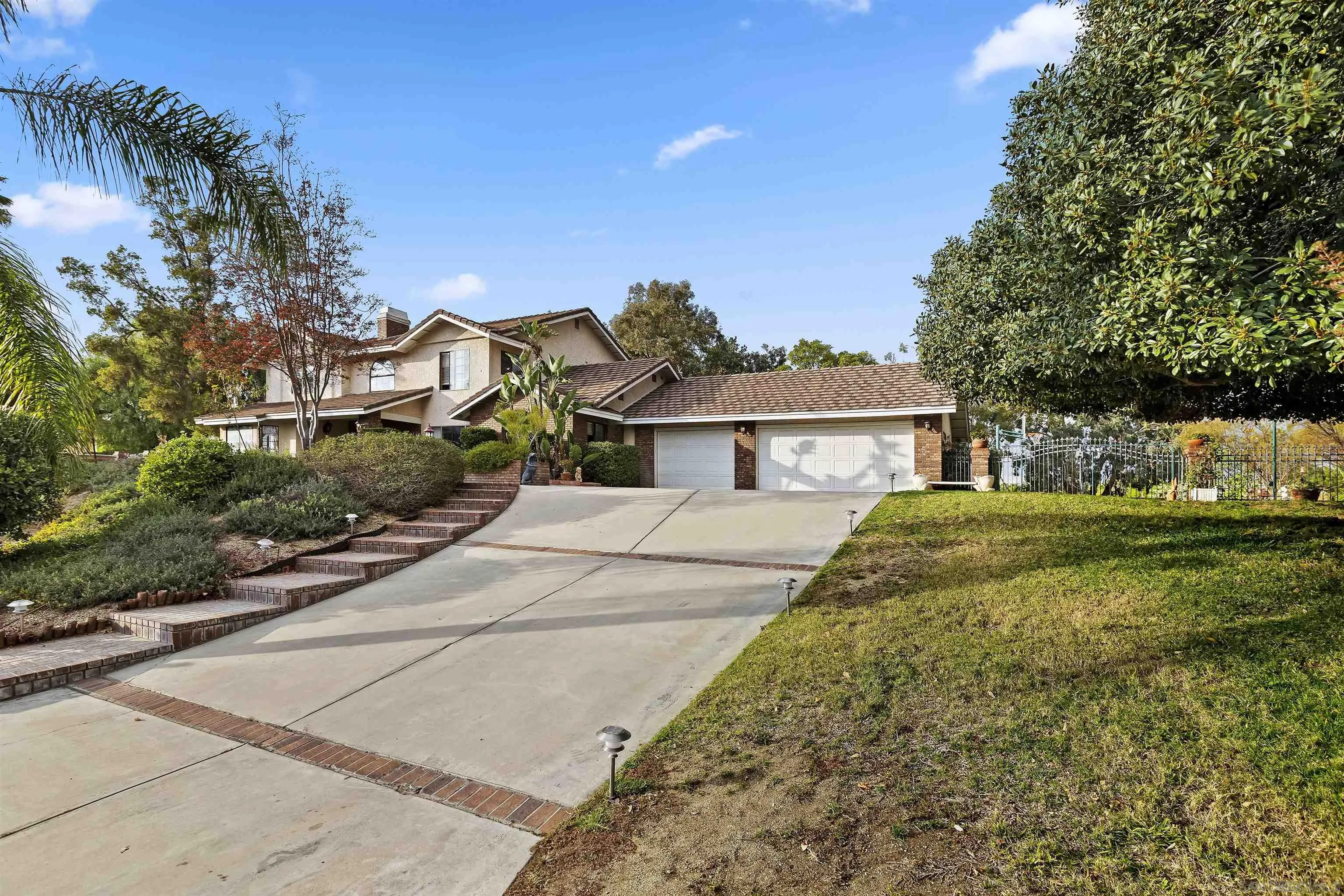 2109 Old Bridge Road Riverside, CA 92506 - Photo 11 of 57 a front view of a house with a garden