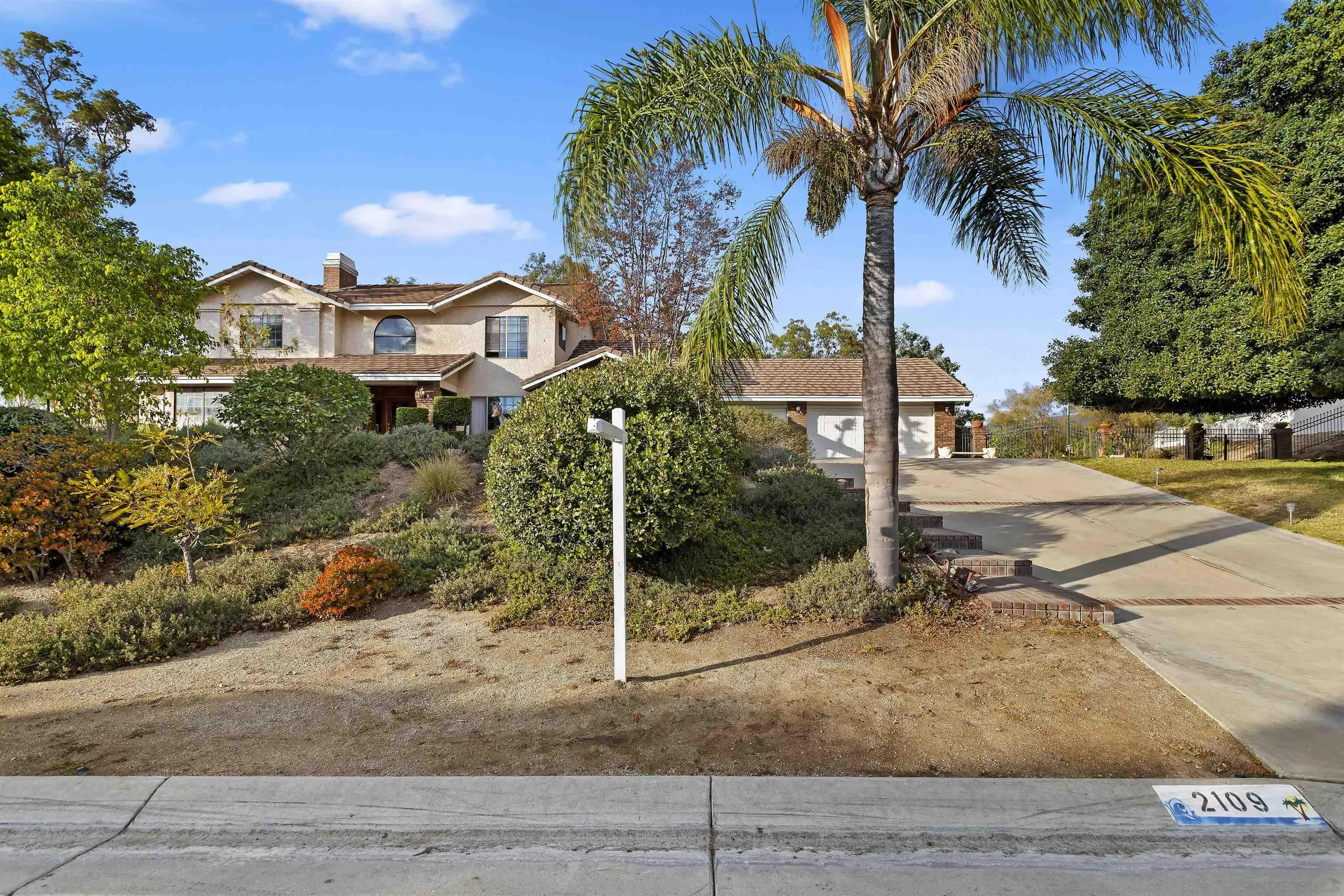 2109 Old Bridge Road Riverside, CA 92506 - Photo 12 of 57 a front view of a house with a yard