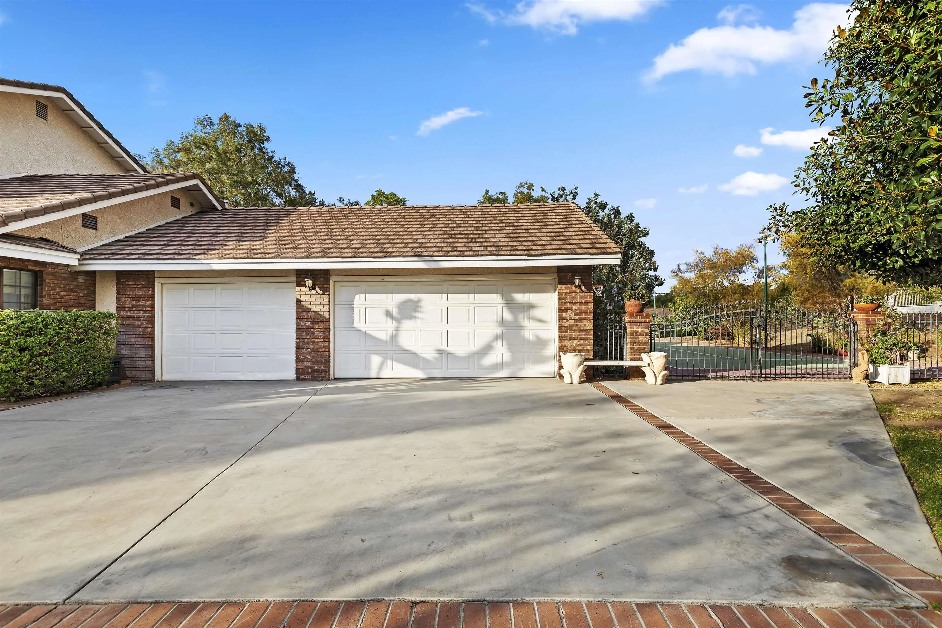 2109 Old Bridge Road Riverside, CA 92506 - Photo 13 of 57 a front view of a house with a garden and tree