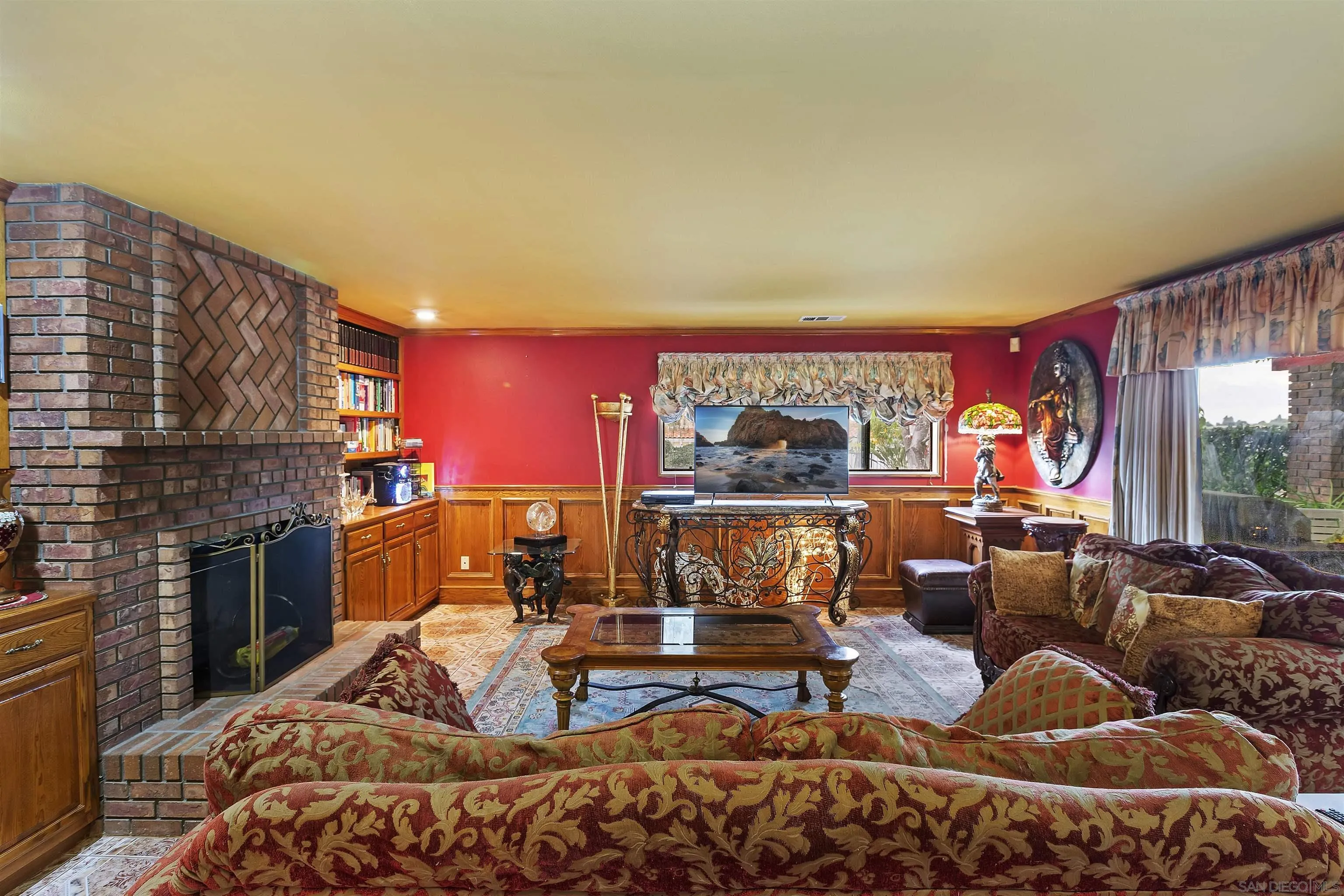 2109 Old Bridge Road Riverside, CA 92506 - Photo 21 of 57 a living room with furniture a fireplace and a floor to ceiling window