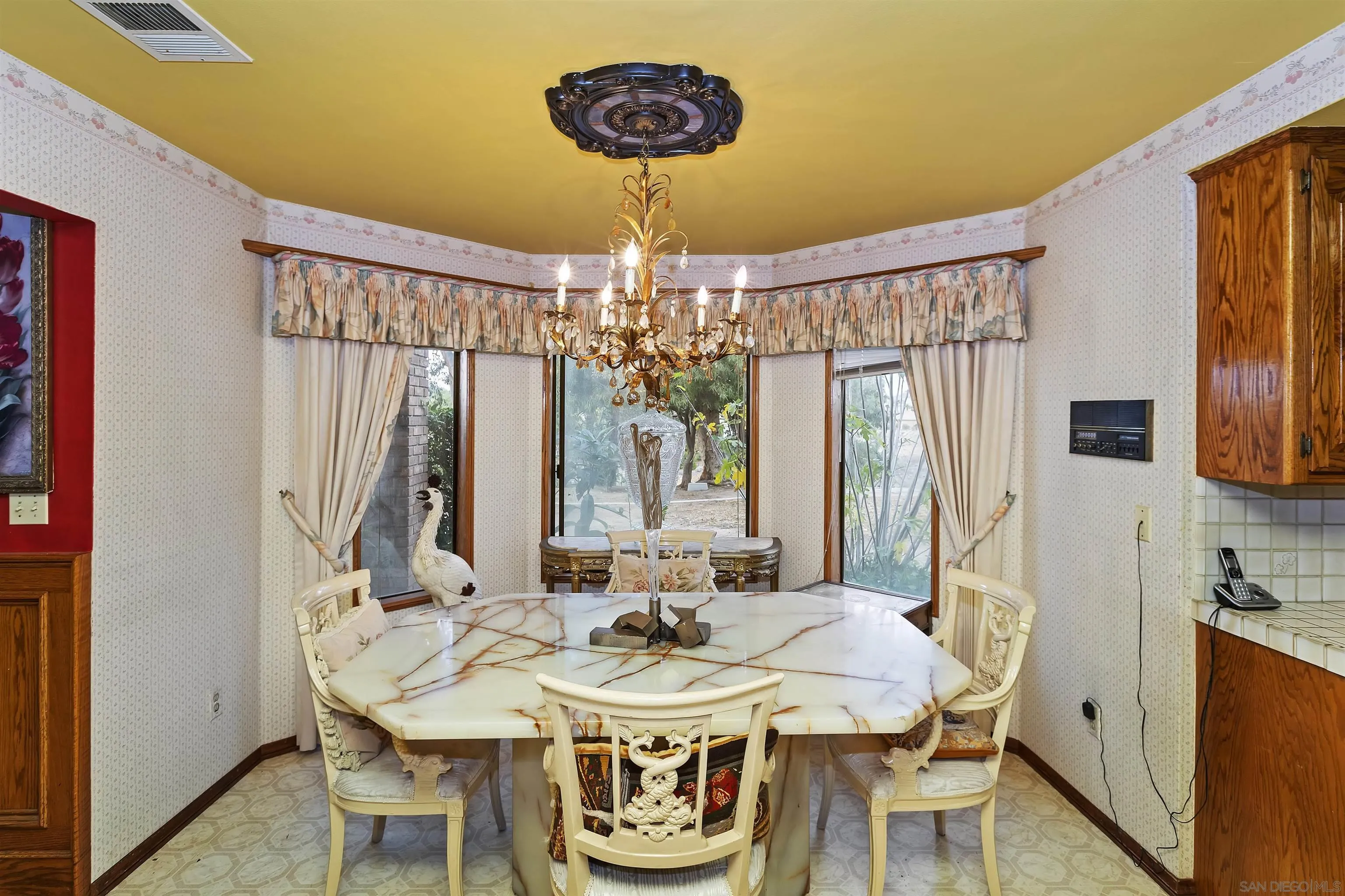 2109 Old Bridge Road Riverside, CA 92506 - Photo 28 of 57 a view of a dining room with furniture and chandelier