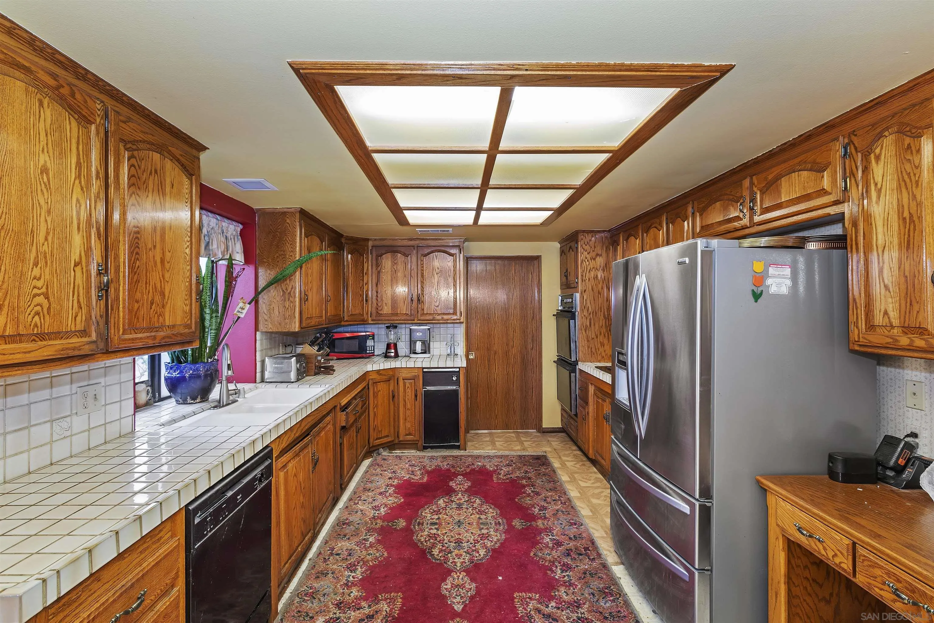 2109 Old Bridge Road Riverside, CA 92506 - Photo 29 of 57 a kitchen with granite countertop lots of counter top space and stainless steel appliances