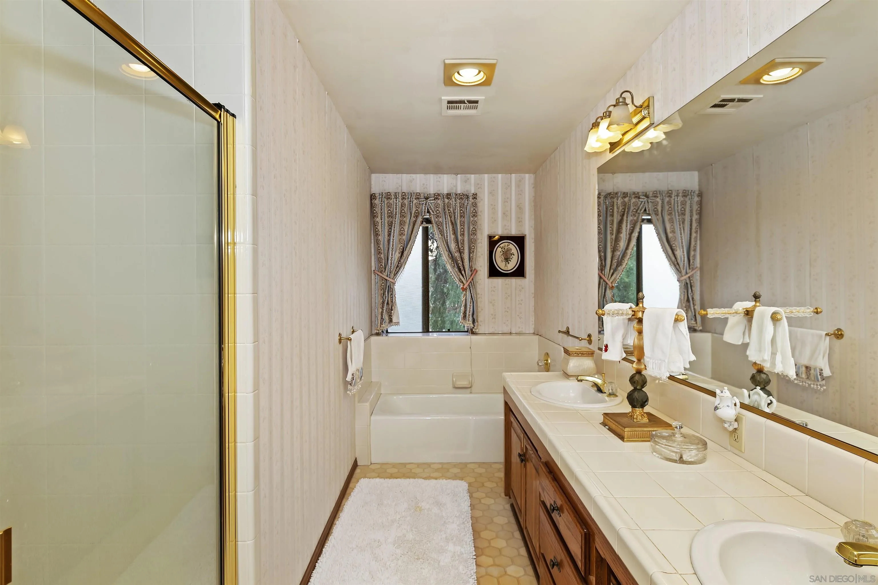 2109 Old Bridge Road Riverside, CA 92506 - Photo 35 of 57 a en suite bathroom with a double vanity sink and a mirror