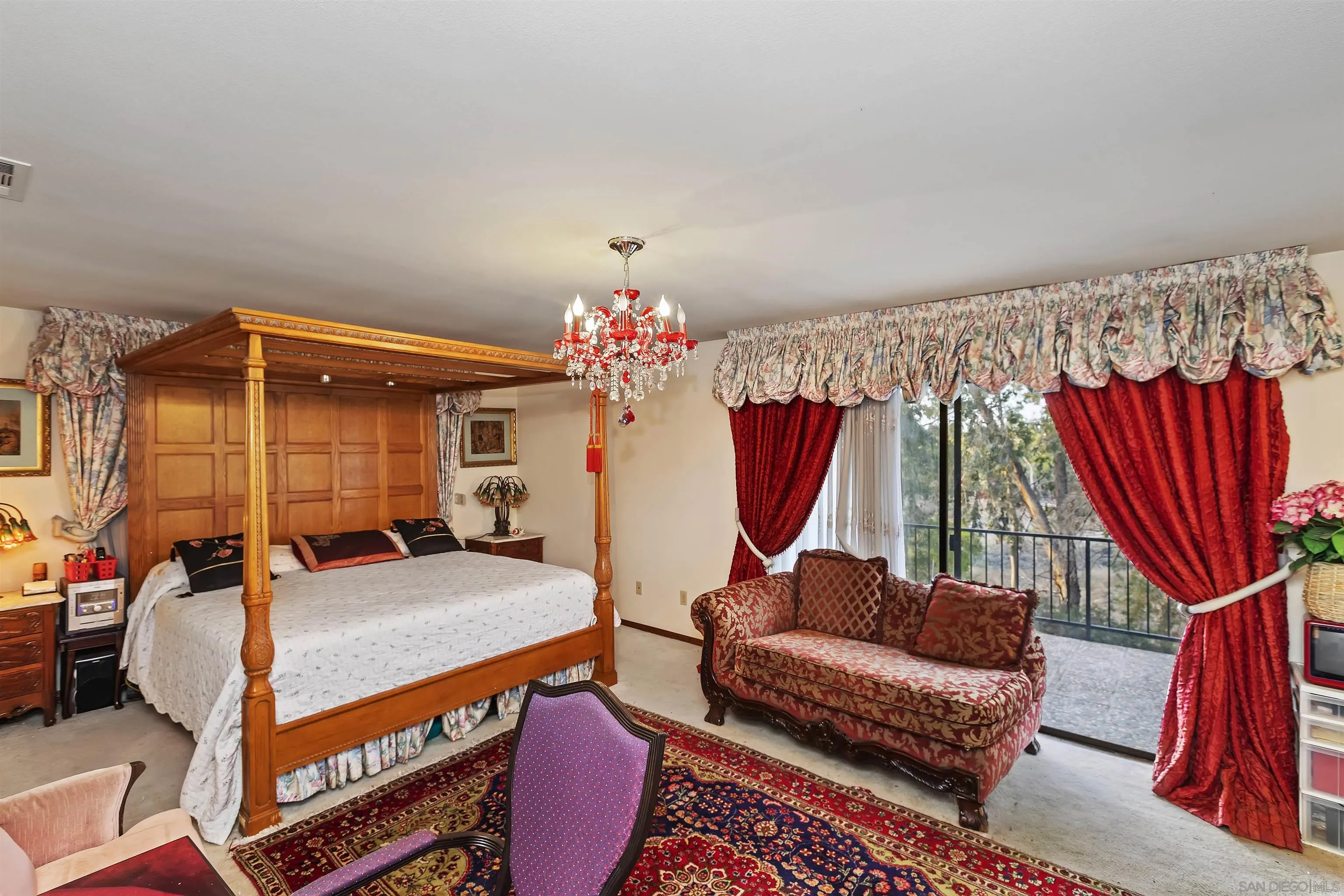 2109 Old Bridge Road Riverside, CA 92506 - Photo 38 of 57 a bedroom with furniture and a chandelier