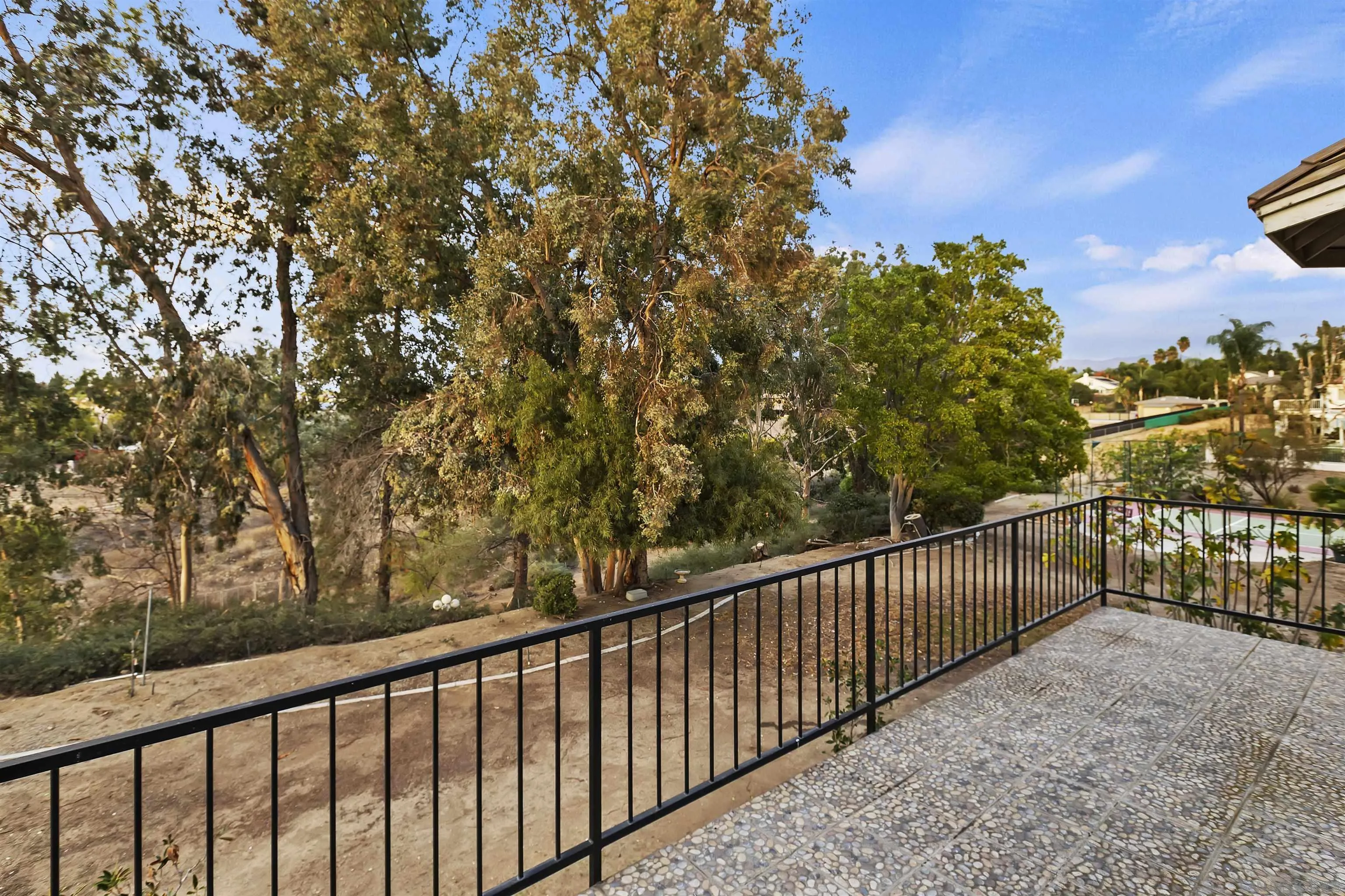 2109 Old Bridge Road Riverside, CA 92506 - Photo 40 of 57 a view of a balcony with wooden fence and floor