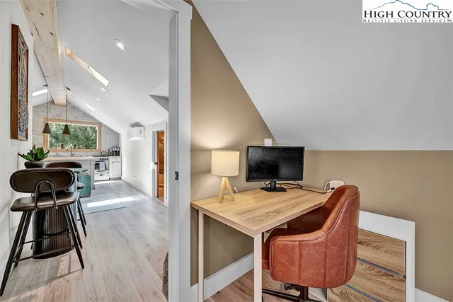 a view of a workspace with furniture and a couch