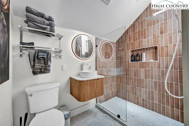a bathroom with a toilet a sink and bathtub