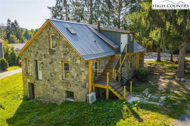 a aerial view of a house with a yard
