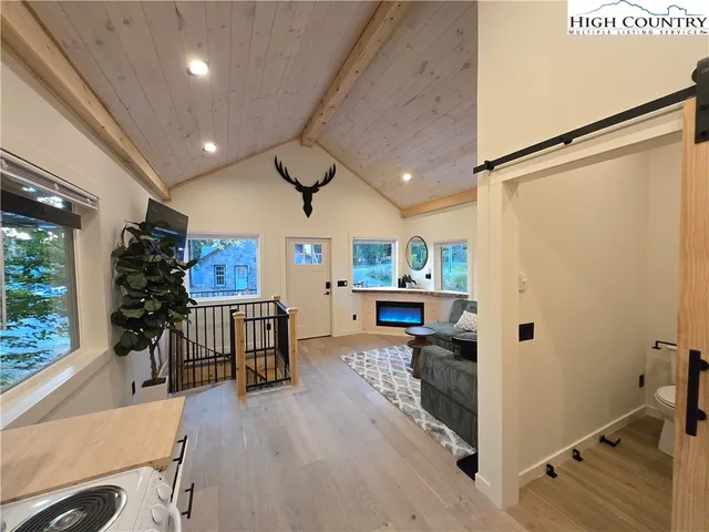 a view of a kitchen with furniture and a window