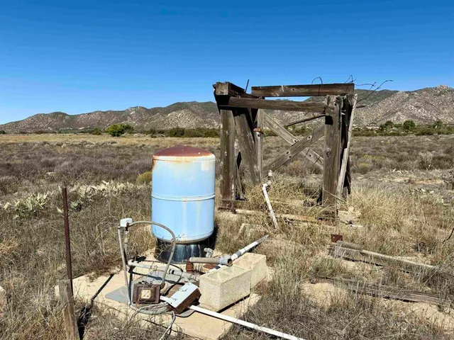 a street sign on a wall next to a building