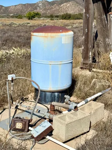 a view of mountain with sunset