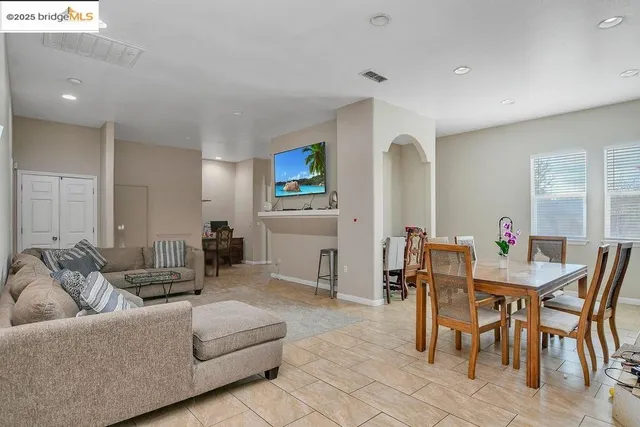 a kitchen with stainless steel appliances granite countertop a refrigerator sink and cabinets