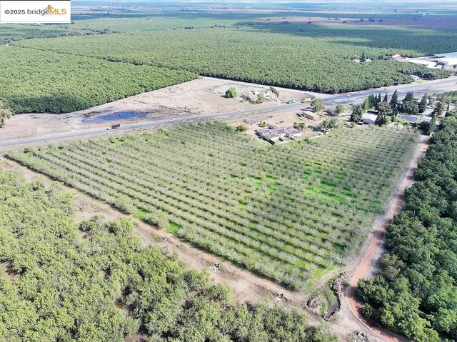 a view of a backyard of the house