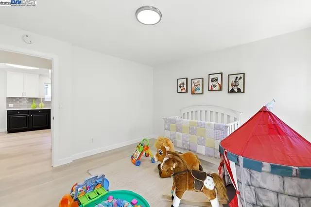 a bedroom with bed and a window