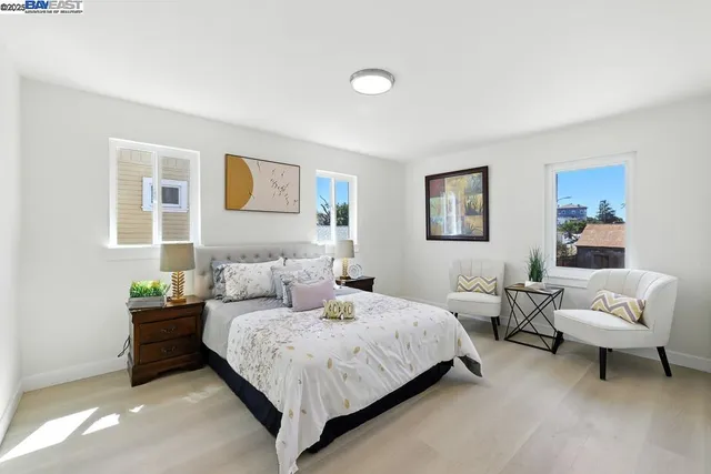 a bedroom with a bed and a couch