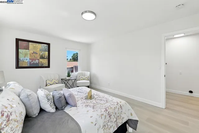 a living room with furniture and a chair
