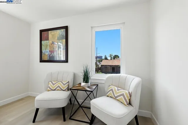 a living room with furniture flower pot and a fireplace
