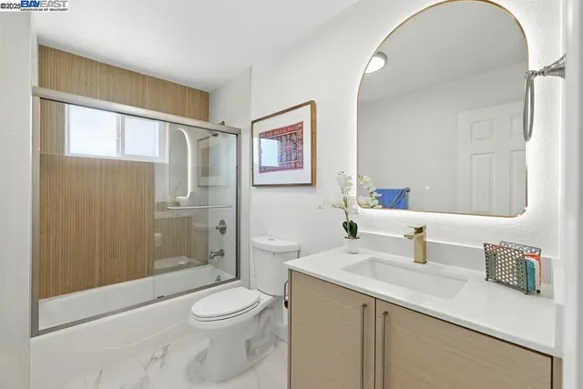 a living room with furniture potted plant and a window