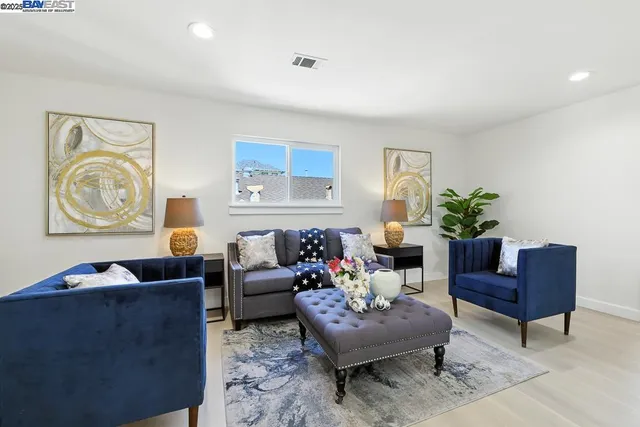 a living room with furniture rug and window