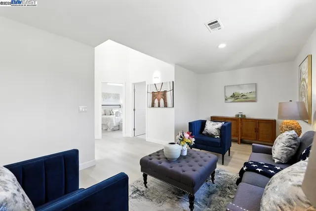 a bedroom with a bed and a couch