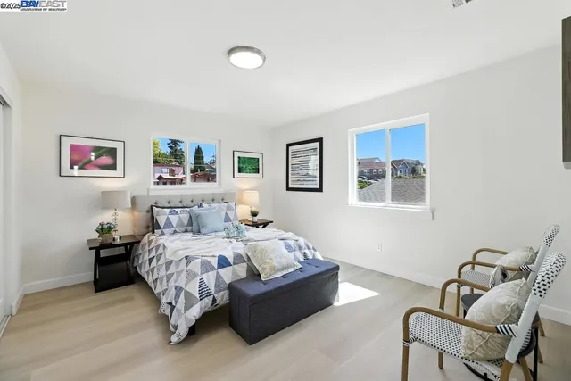 a bedroom with a bed and a cabinets