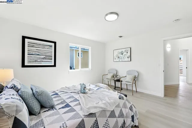 a bedroom with a bed and a cabinets