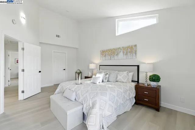 a view of a dining room with furniture and a potted plant
