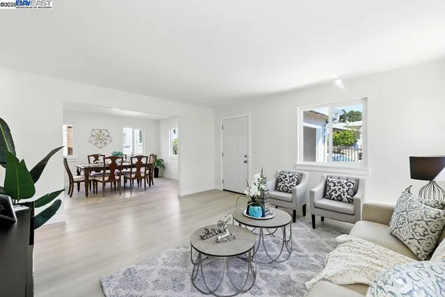 a view of a dining room with furniture and window