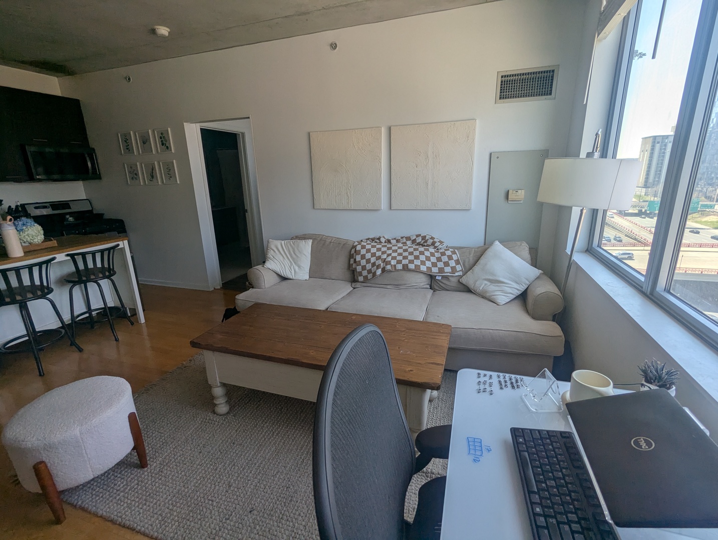 659 West Randolph Street, Unit 711 Chicago, IL 60661 - Photo 4 of 14 a living room with furniture and a flat screen tv
