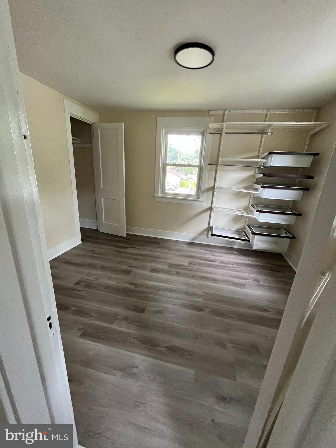 246 South Ironstone Drive Boyertown, PA 19512 - Photo 9 of 9 a view of an empty room with wooden floor and a window