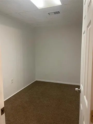 an empty room with a bench