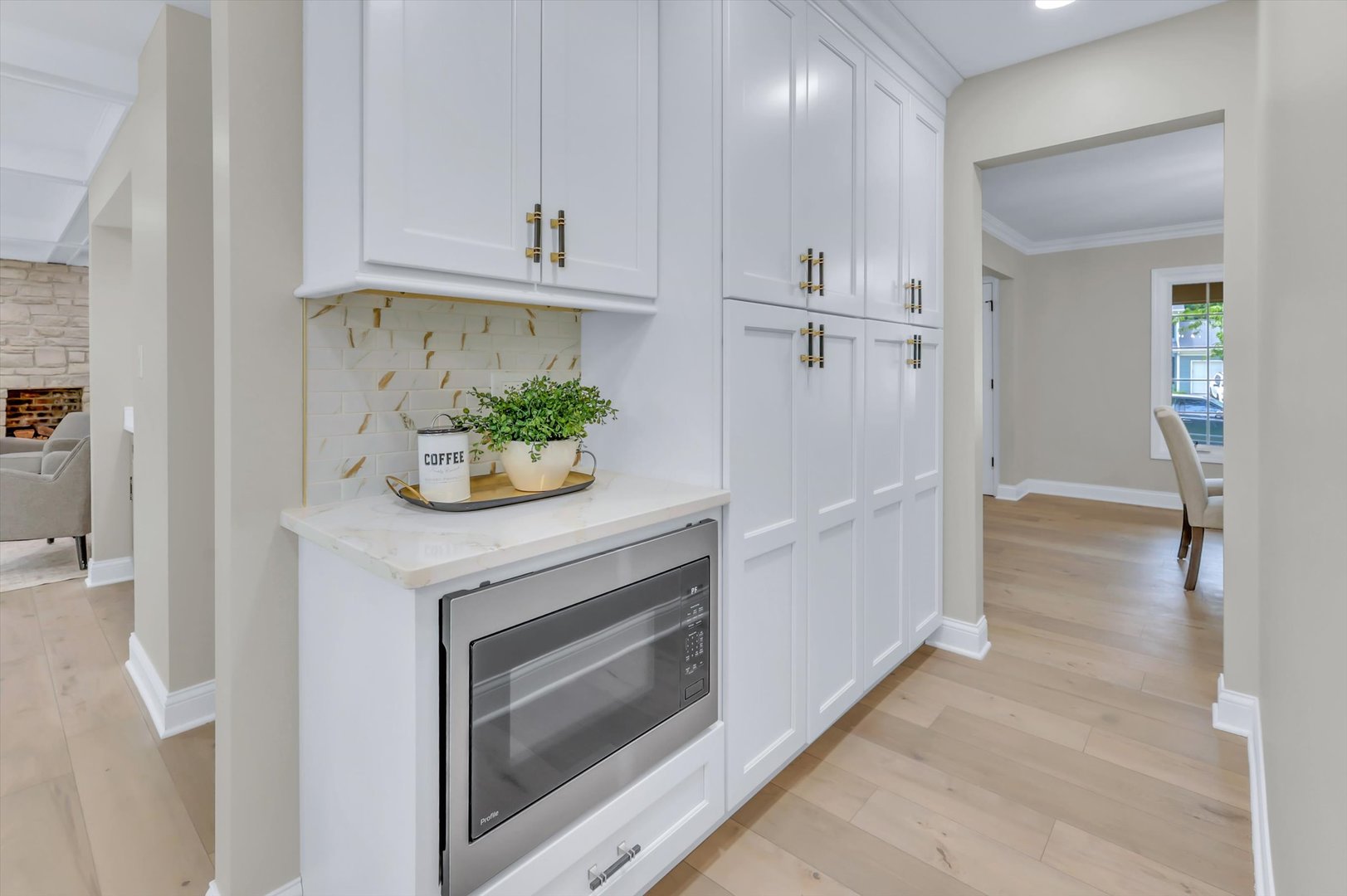 967 West Bauer Road Naperville, IL 60563 - Photo 14 of 37 a kitchen with white cabinets and a sink