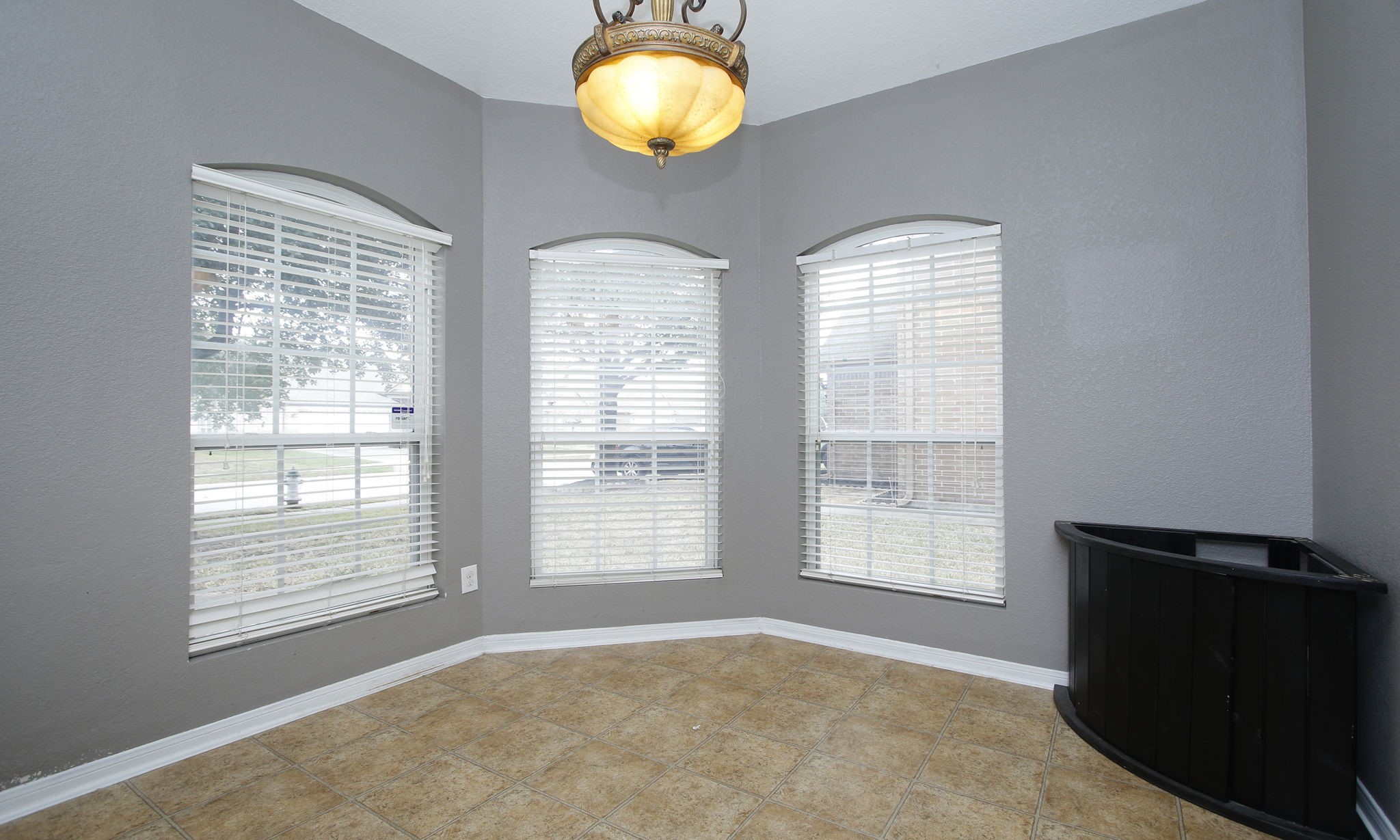 1031 Spring Heights Drive Spring, TX 77373 - Photo 16 of 41 a view of an empty room with wooden floor and a window