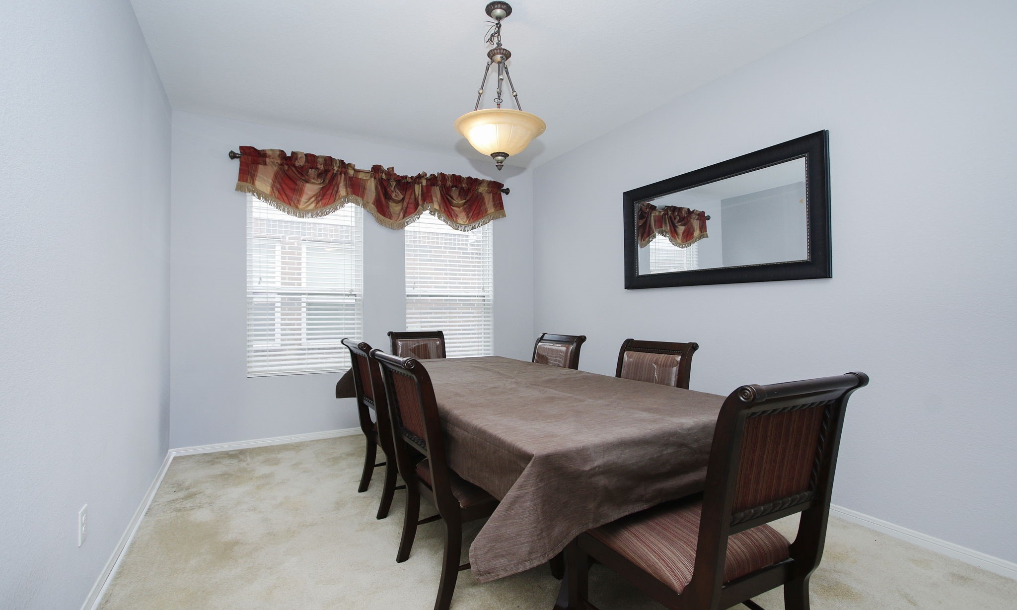 1031 Spring Heights Drive Spring, TX 77373 - Photo 18 of 41 a view of a dining room with furniture window and wooden floor