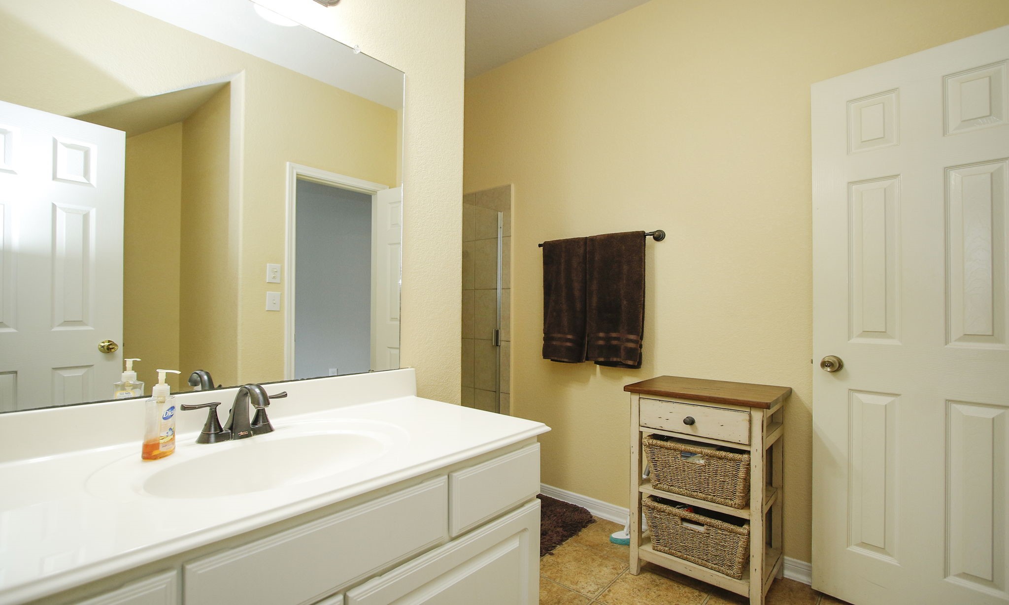 1031 Spring Heights Drive Spring, TX 77373 - Photo 22 of 41 a bathroom with a sink and a mirror