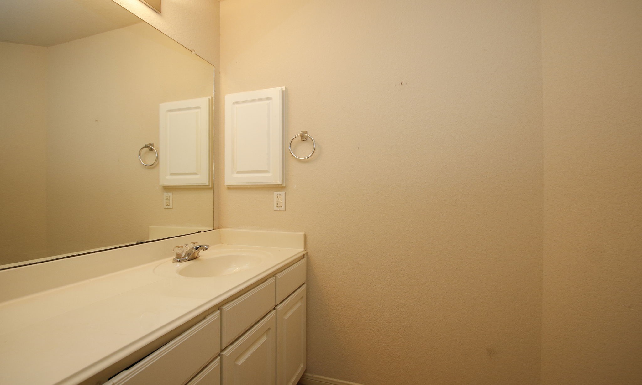 1031 Spring Heights Drive Spring, TX 77373 - Photo 35 of 41 a bathroom with a sink and a mirror
