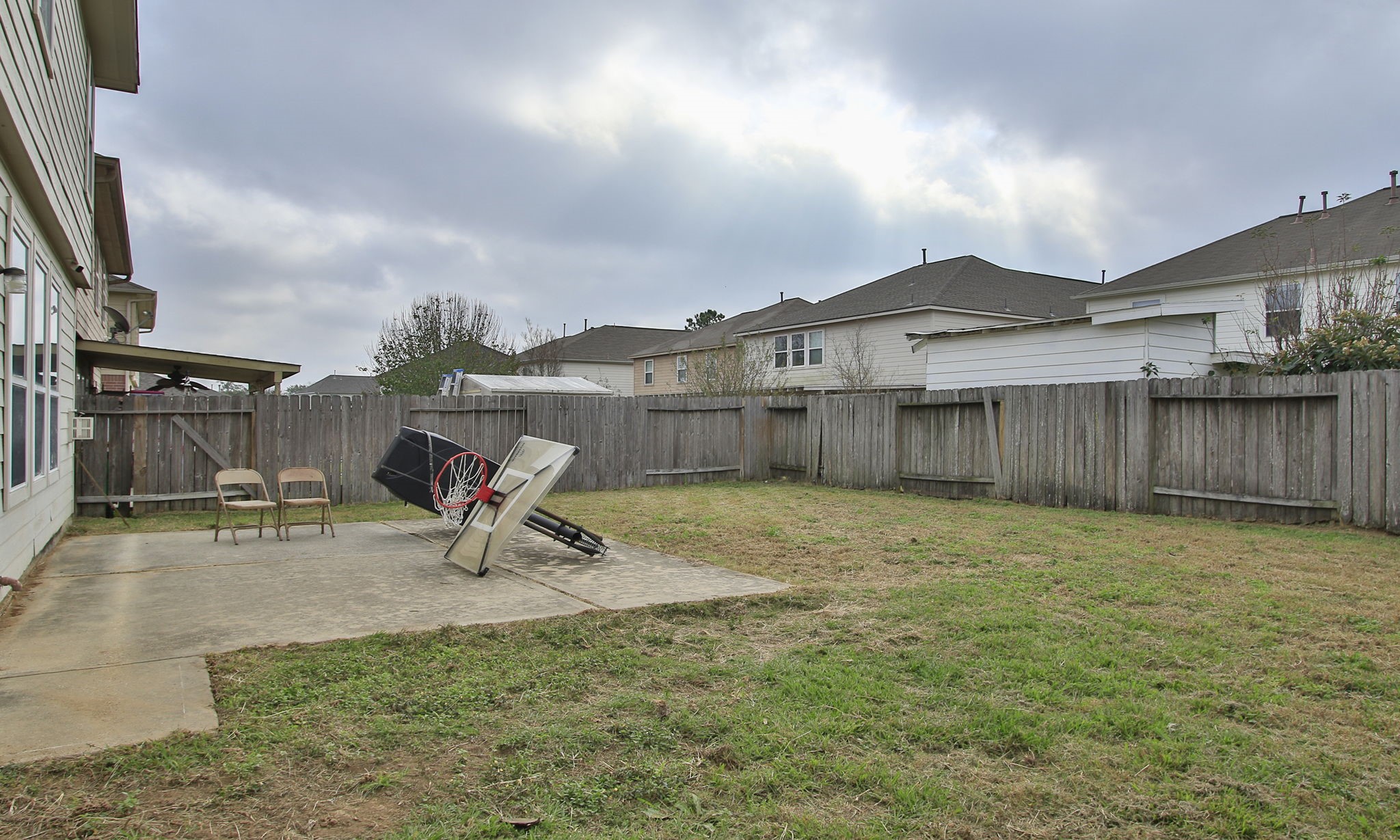 1031 Spring Heights Drive Spring, TX 77373 - Photo 36 of 41 a view of a backyard with table and chairs