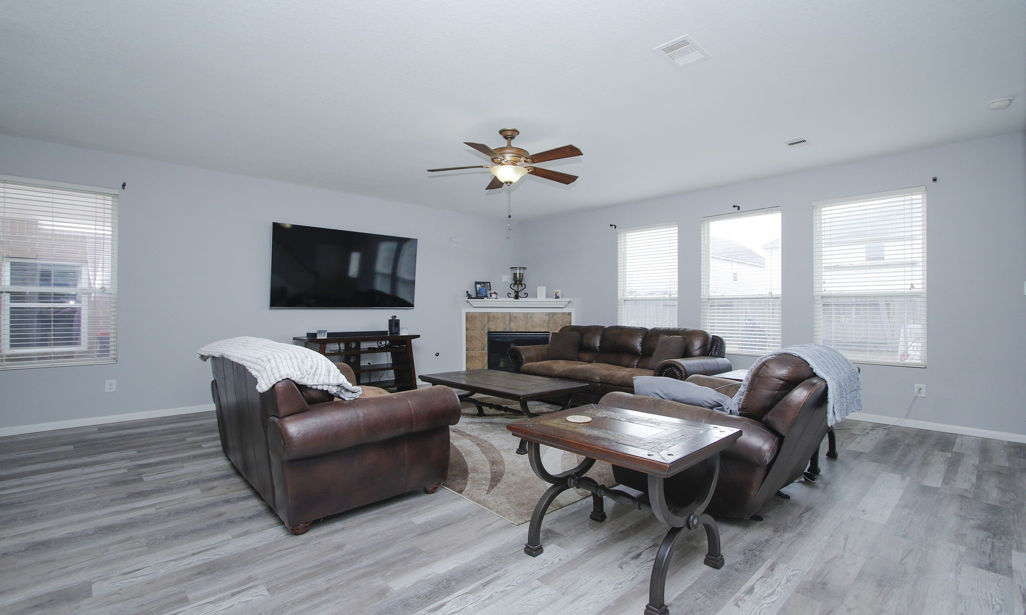 1031 Spring Heights Drive Spring, TX 77373 - Photo 8 of 41 a living room with furniture a flat screen tv and a window