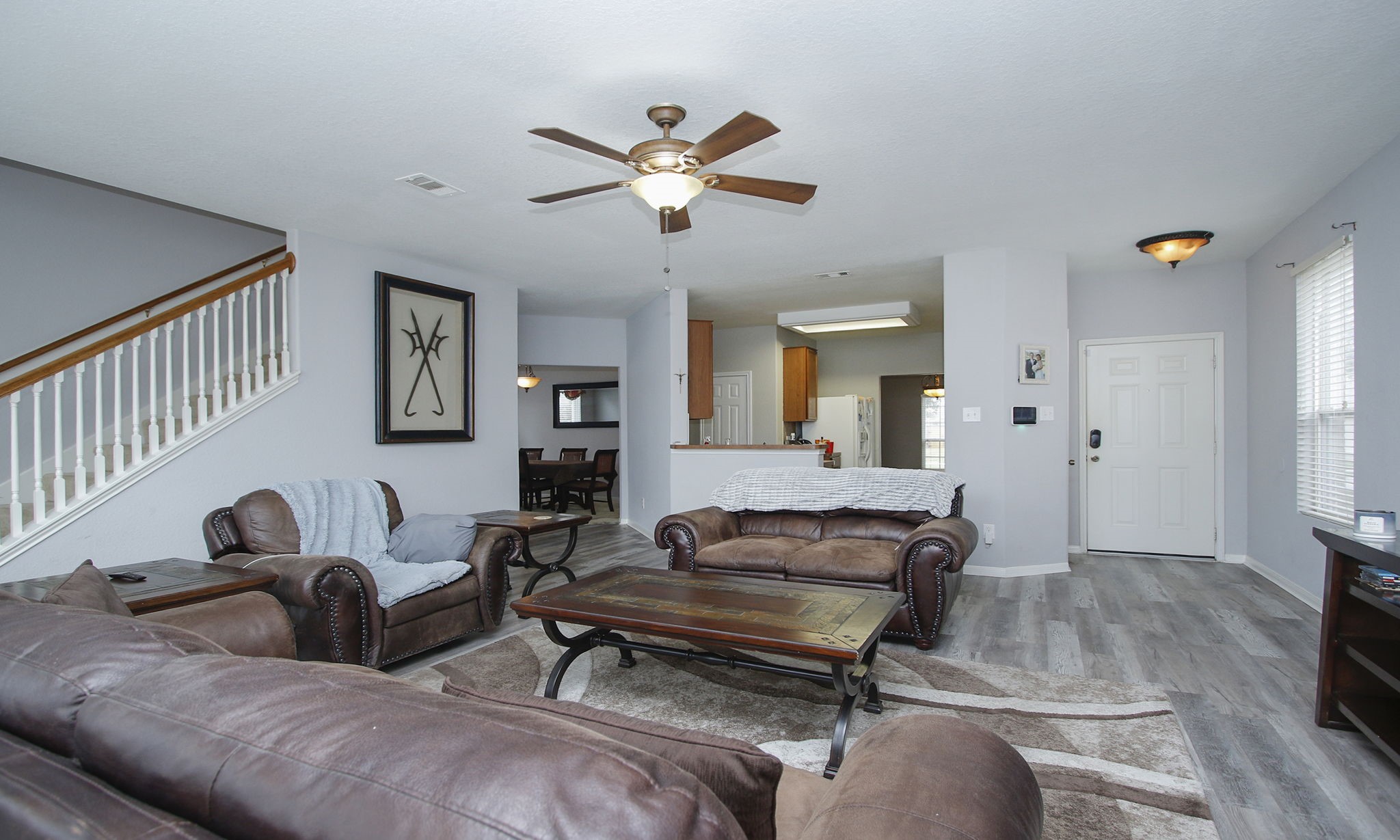 1031 Spring Heights Drive Spring, TX 77373 - Photo 10 of 41 a living room with furniture a ceiling fan and a rug