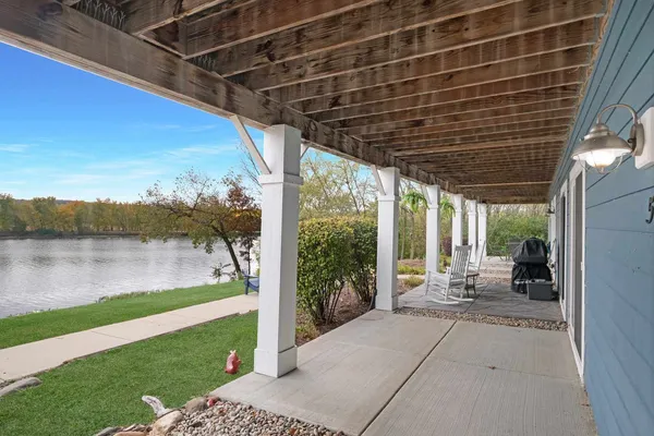 a porch with yard and outdoor seating