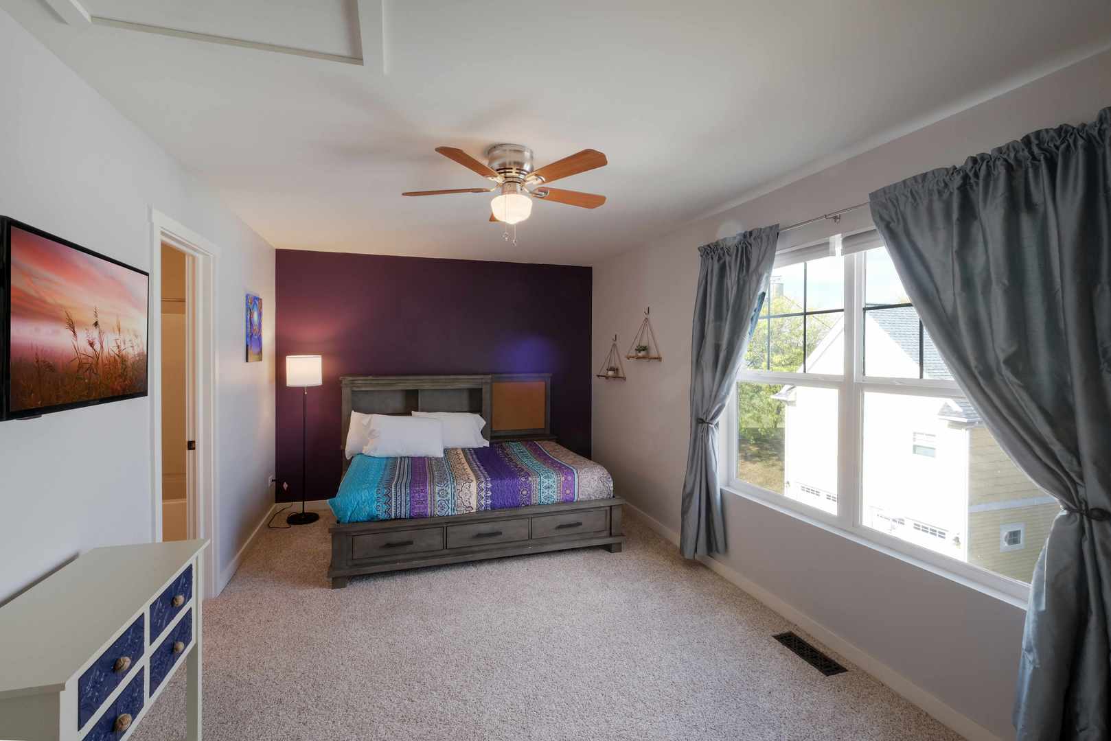 5 River Row Ottawa, IL 61350 - Photo 6 of 24 a bedroom with a bed and a chandelier