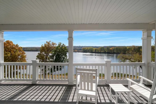 a view of a chairs on wooden deck