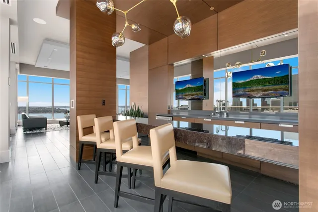 a large kitchen with a table and chairs