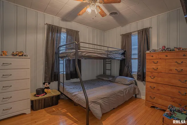a bedroom with a bed and furniture