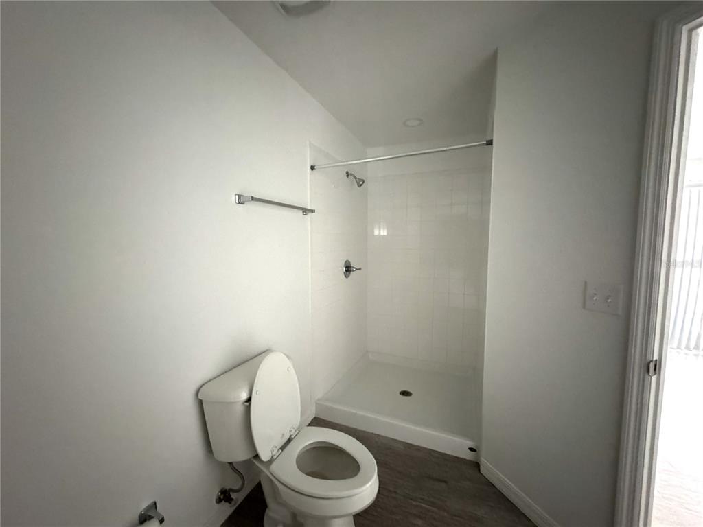 6386 East Rush Street Inverness, FL 34452 - Photo 12 of 21 a bathroom with a toilet a sink and shower